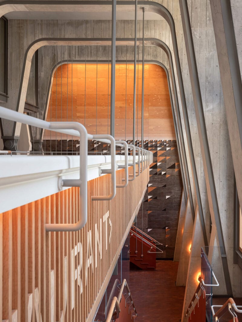 Shim-Sutcliffe boldly suspended a bar from steel rods in the triple-height lobby of the Ace Hotel Toronto.