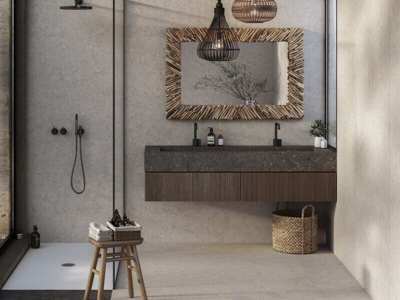 Interior modern neutral bathroom with stone tile floor and wall coverings