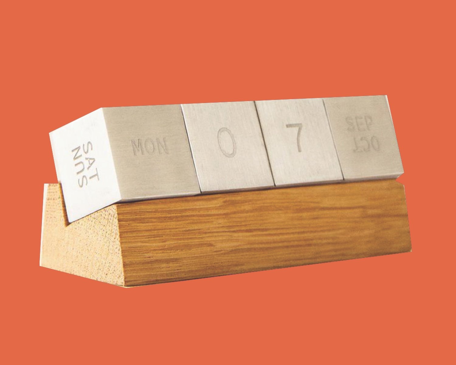 One of Azure's top gifts for architects from our 2024 guide is this desk calendar featuring steel cubes resting on a wooden podium.