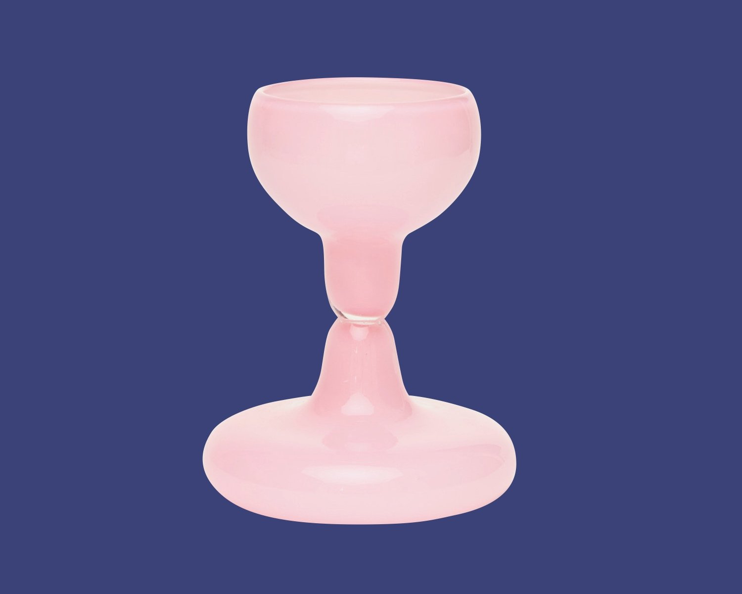 One of Azure's top gifts for designers from our 2024 guide is this hourglass-shaped pink wine glass.