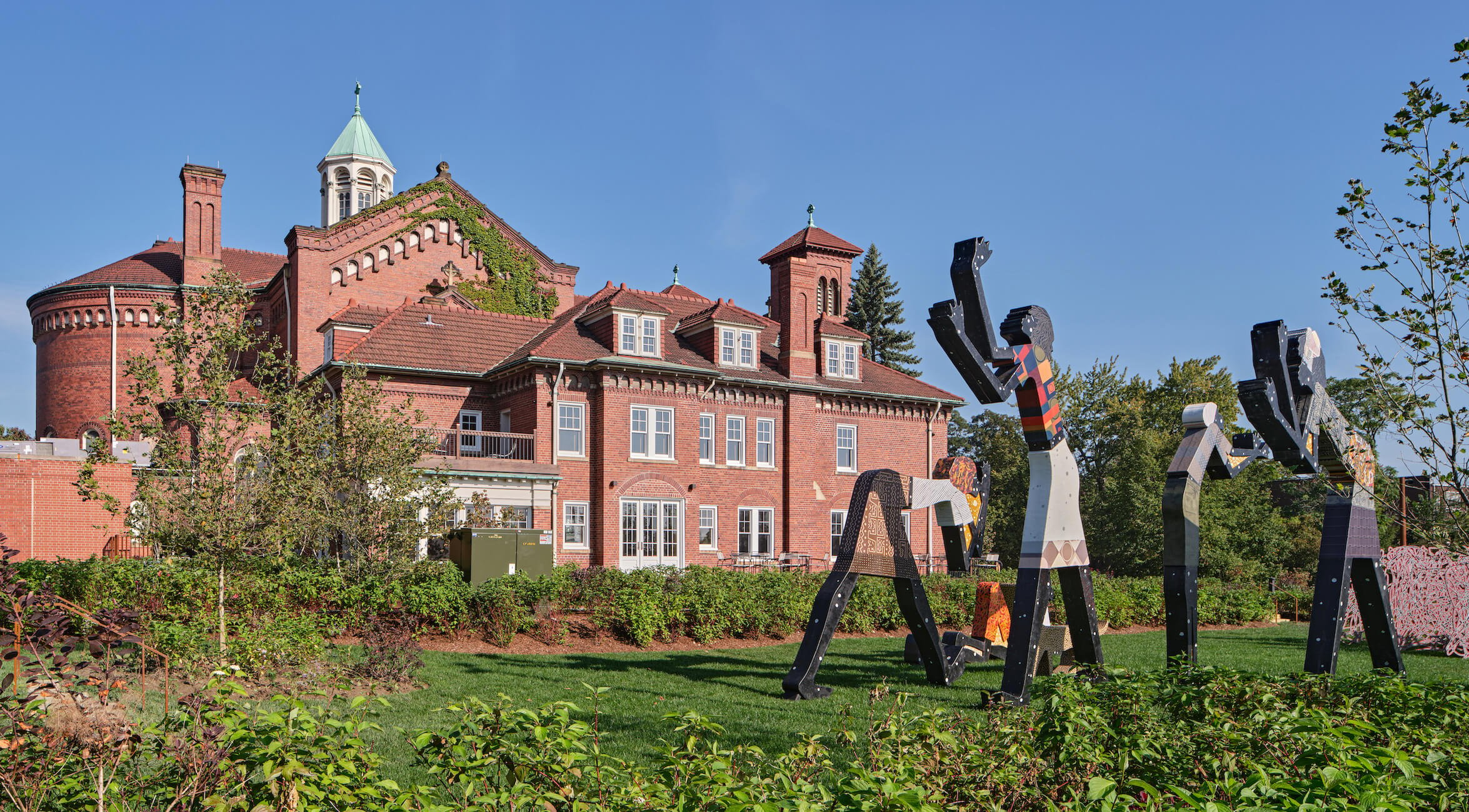 Outside, The Shepherd's programming is extended into the public realm with a sculpture garden honouring Charles McGee.