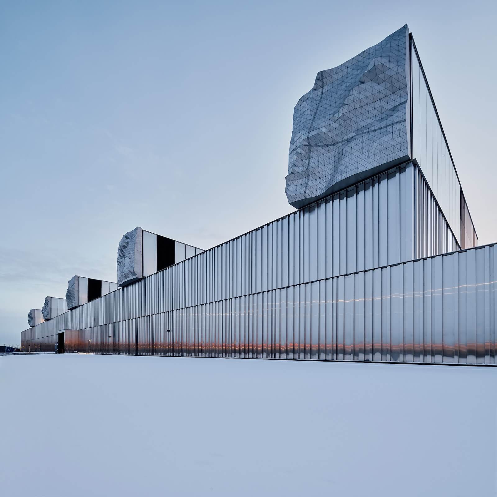 One of Gh3*’s many public works projects in Edmonton, the Kathleen Andrews Transit Garage is a heroic structure sheathed in metal. Its five rooftop light wells are capped in sculptures by Berlin artist Thorsten Goldberg