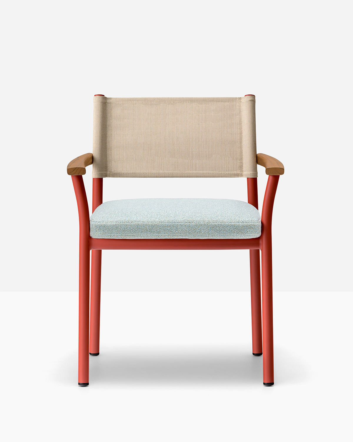 Red aluminum chair with teak armrests and blue cushions