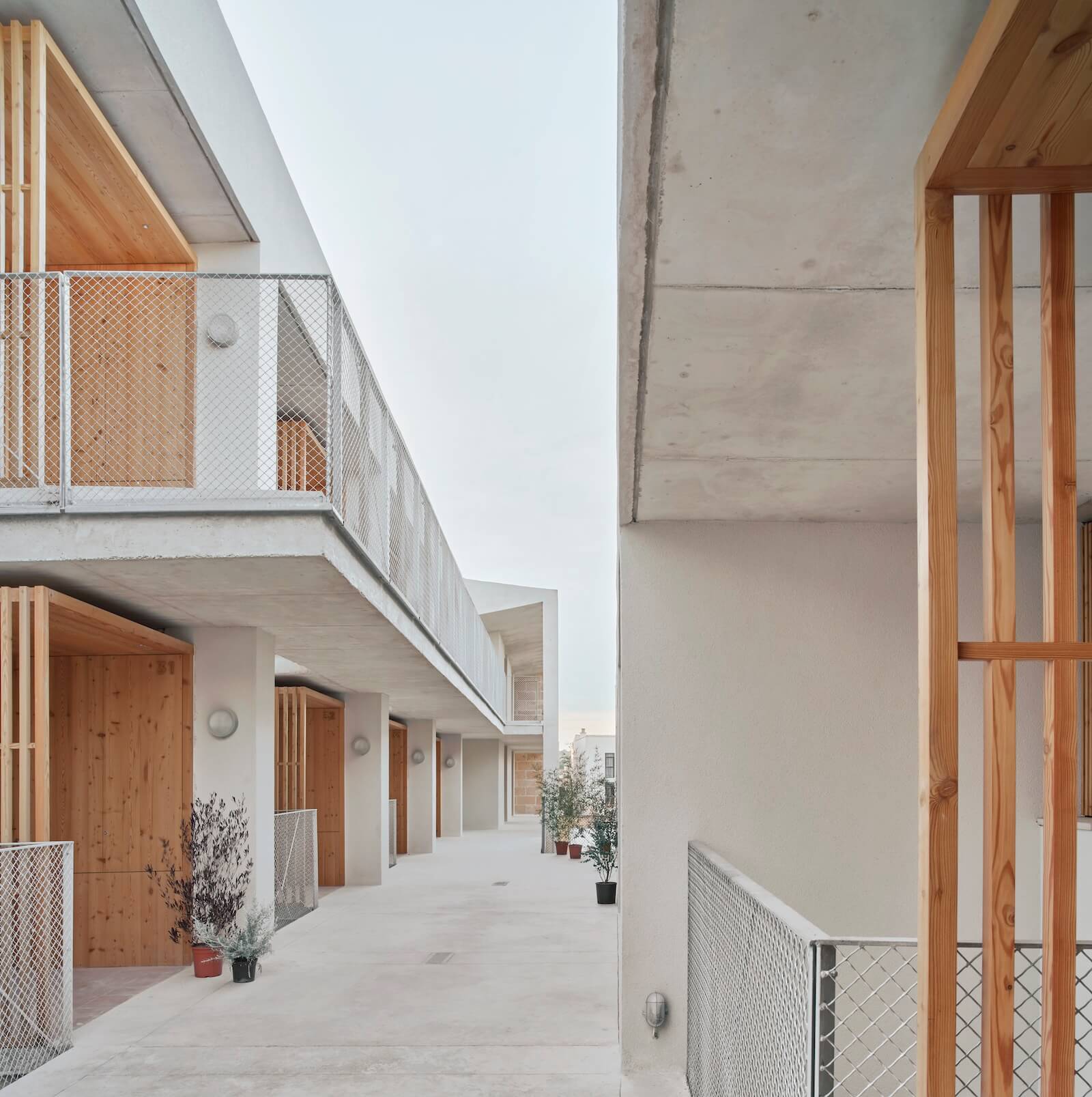 The Son Servera social housing features 42 units, stacked on three levels. The floor slabs between them are carved to let breezes circulate and sunlight reach the lower levels.