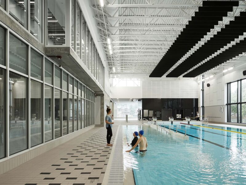 View of the pool and second-storey observation decks at the Rosemont Aquatic Centre by Poirier-Fontaine-Architectes