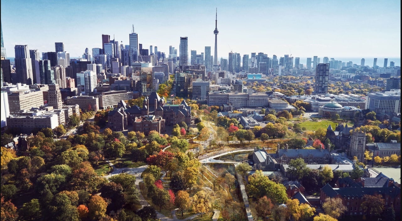 Aerial rendering of the proposed University Avenue park revitalization, showing the new greenery alongside the Ontario legislature, with the Toronto skyline in the background.