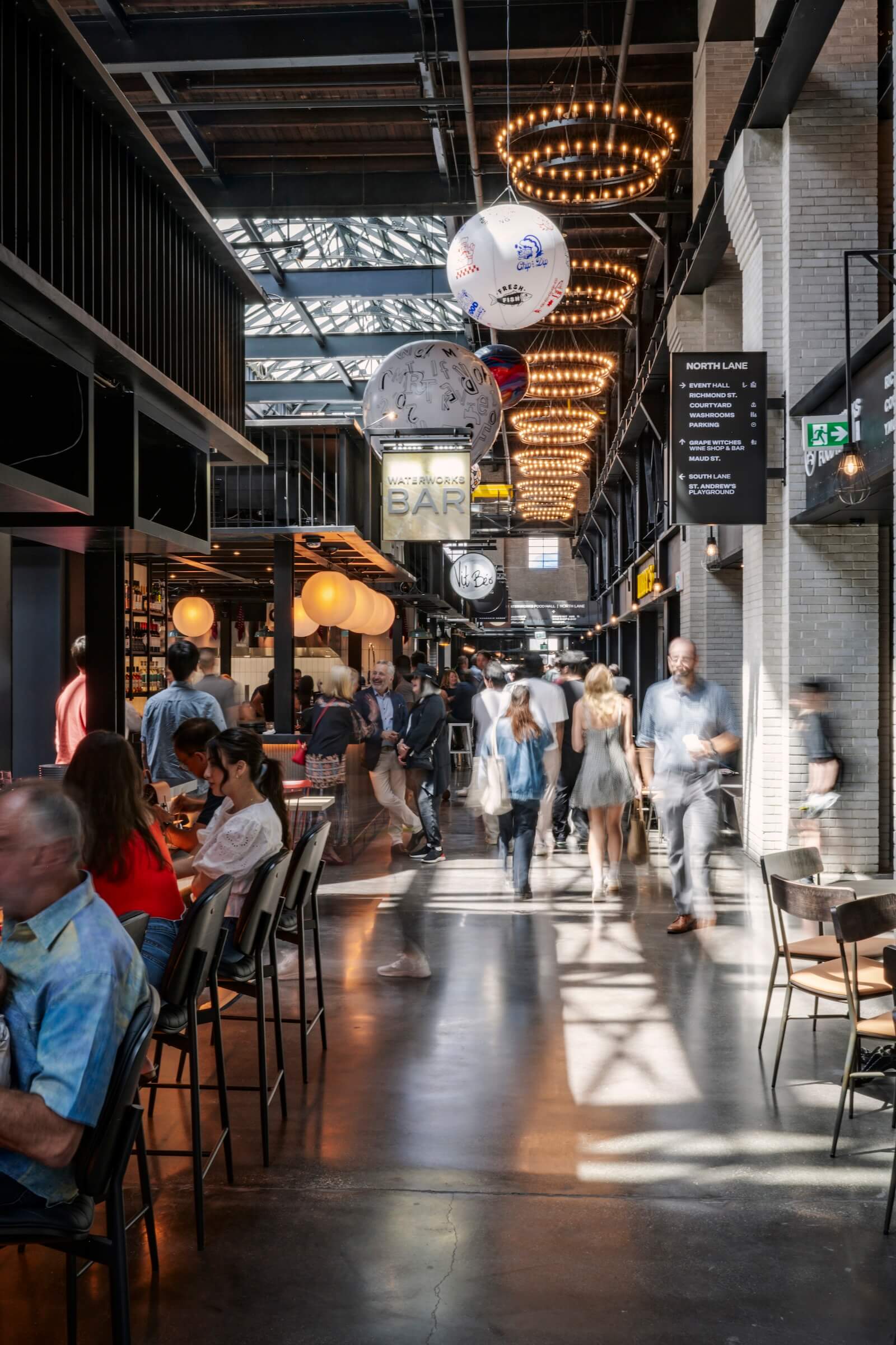 People eat inside Toronto's Waterworks Food Hall