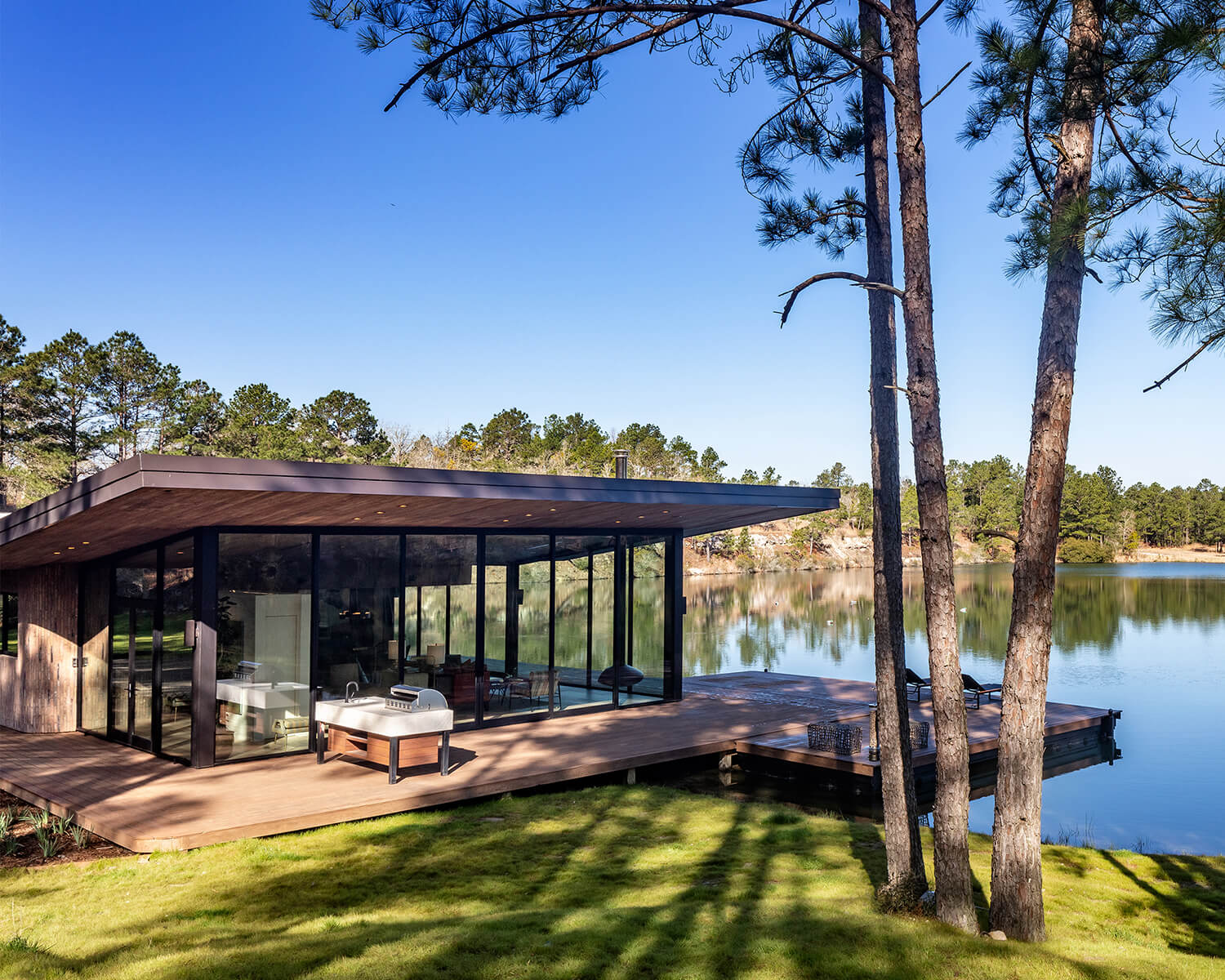 Glass house on lake outside of Houston