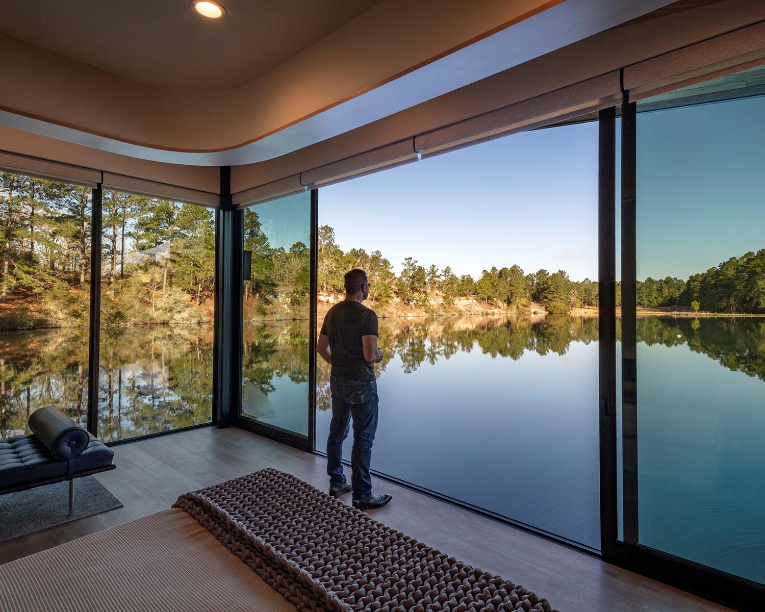 Houston lake house embraces indoor-outdoor living with sliding glass doors by Western Window Systems