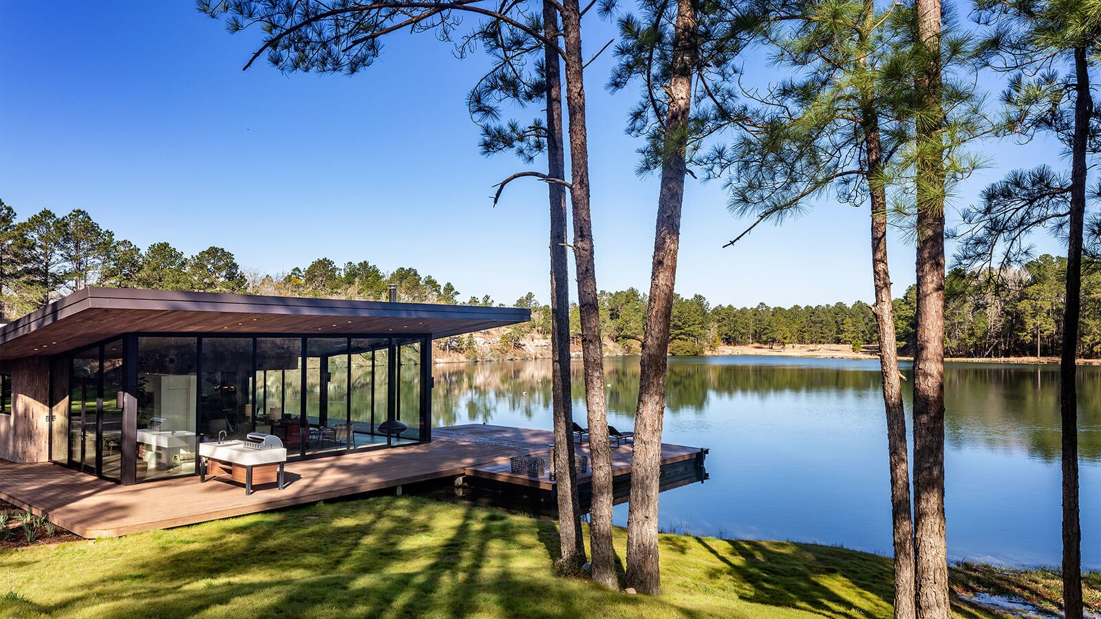 Glass house on lake outside of Houston