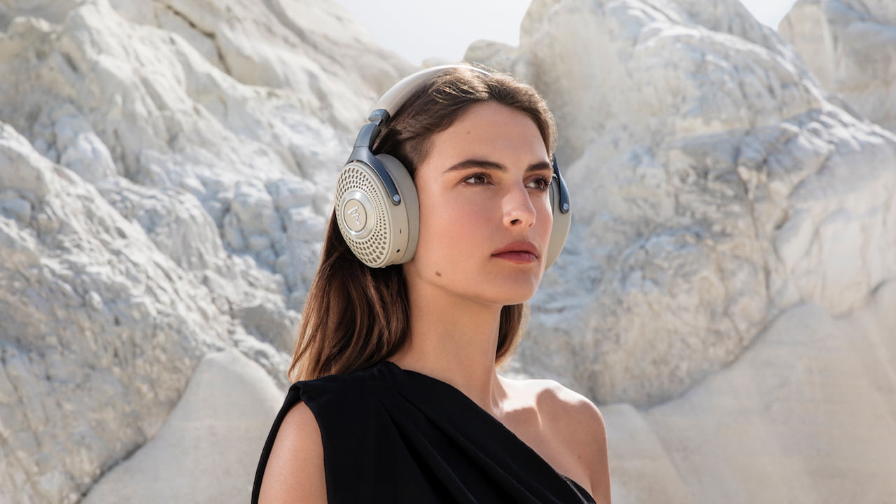 Woman wearing Focal Bathys Headphones in Dune