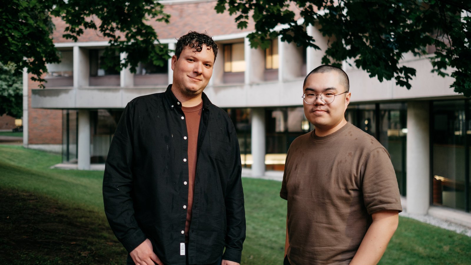 Make Good Projects. Joel Leon and Kurtis Chen pose in front of an apartment building.